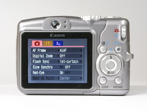 Canon PowerShot A710 IS digital camera displayed from the back showing its LCD screen and menu options.