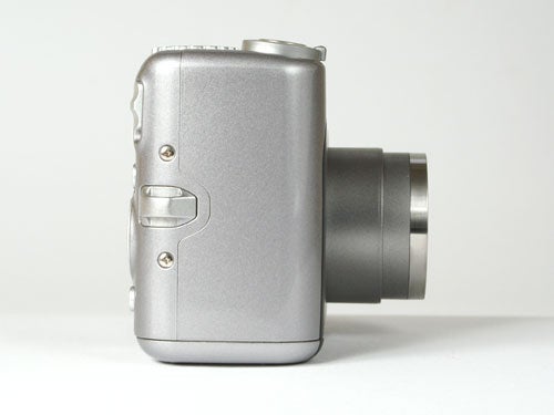 Side view of a Canon PowerShot A710 IS digital camera with the lens extended on a white background.