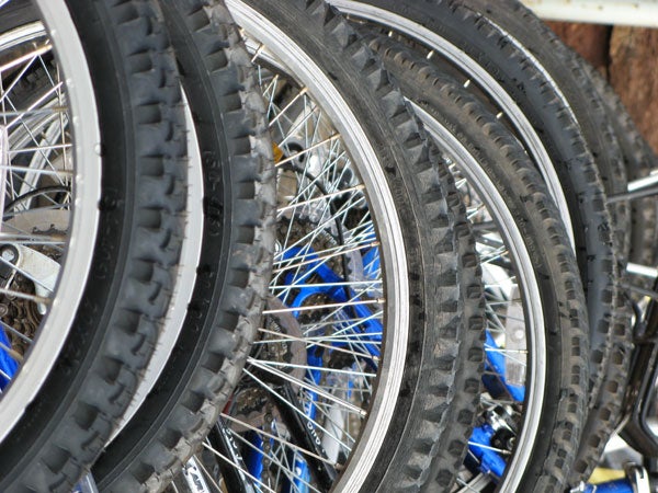 Close-up view of bicycle wheels with detailed tire treads and spokes, possibly showing the depth-of-field capability of the Canon PowerShot A710 IS camera.