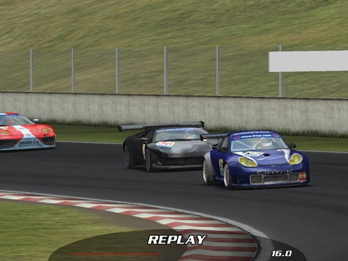 Screenshot from a racing game showing three cars on a track during a replay with a timer indicating 16.0 seconds in the lower right corner.