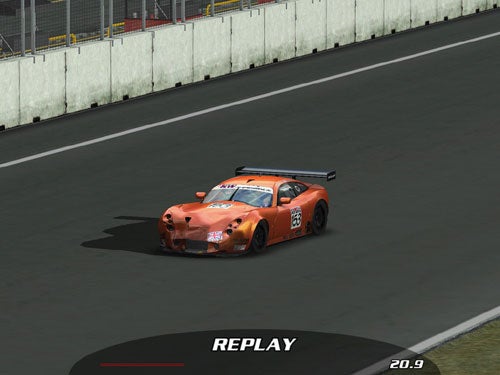 Image of an orange racing car with the number 68 on track during a replay session, indicating a simulation or video game scenario, with a replay timestamp at the bottom.