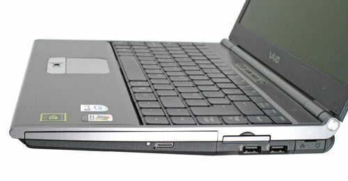 Sony Vaio VGN-SZ2XP laptop partially open showing keyboard, touchpad, and external ports on the side.