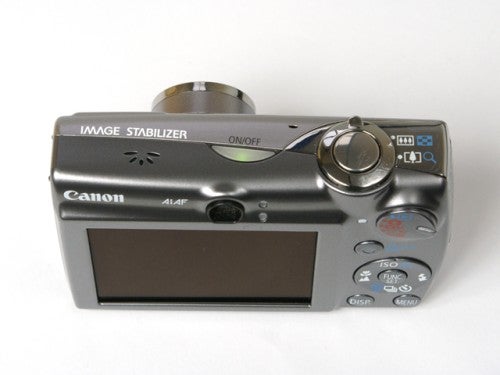 Canon Digital IXUS 850 IS compact digital camera on a white background showing the back panel with the LCD screen, control buttons, and the Image Stabilizer label.
