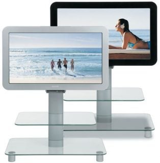 Sanyo CE-32LDY1 32-inch LCD TV displayed on a glass stand with a beach scene on the screen.