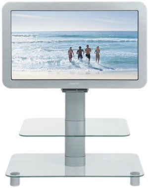 Sanyo CE-32LDY1 32-inch LCD television on a stand with two glass shelves, displaying an image of four people running on the beach.