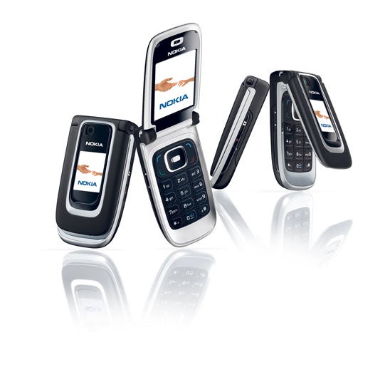Three Nokia 6131 flip phones on a white background with reflective surface, one closed, one half-open and one fully open, showcasing exterior and interior screens and keypad.