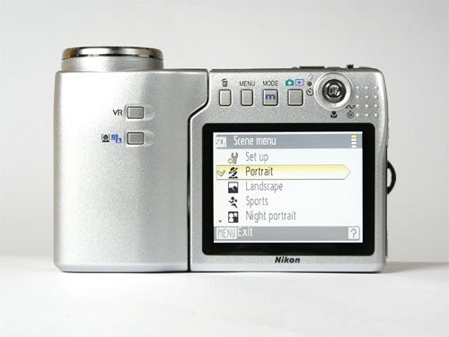 Nikon Coolpix S10 digital camera with swivel lens design and scene menu displayed on the LCD screen.