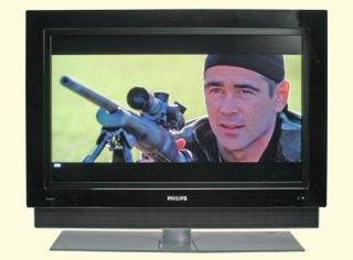 Philips Cineos 37PF9731D 37-inch LCD TV displaying a scene from a movie with a man wearing a beret and aiming a sniper rifle.