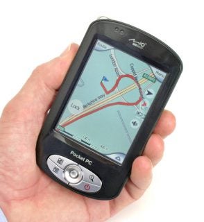 A hand holding a Mio DigiWalker P550 Navigation PDA displaying a map with a route and various navigation buttons on the screen.