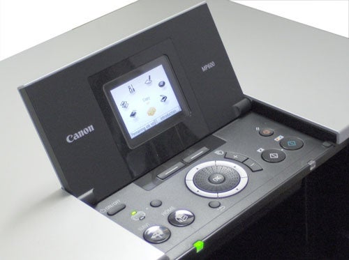 Close-up of the control panel on a Canon PIXMA MP600 All-in-One printer, displaying the LCD screen with menu options and various function buttons.