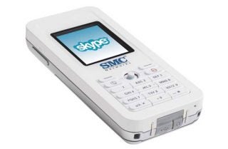 White SMC WSKP100 Skype Phone with large screen displaying the Skype logo, numeric keypad, and call control buttons on a plain background.