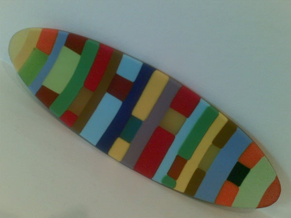 Multicolored geometric pattern on a curved surface, possibly a skin or cover for a Nokia 5500 Sport mobile phone.