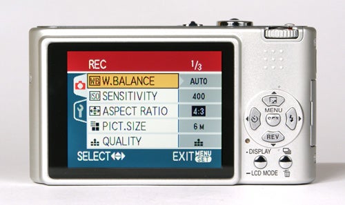 Panasonic Lumix DMC-FX3 digital camera displayed from the back showing the camera's LCD screen with settings menu and buttons.