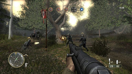 First-person perspective screenshot from the video game Call of Duty 3 showing a player's gun aimed at enemy soldiers in a forest battlefield, with game HUD elements indicating ammo count, compass, and objectives.