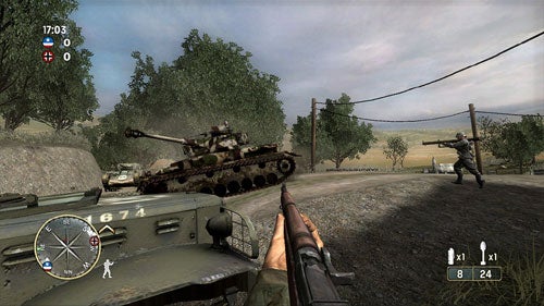 A screenshot from the video game Call of Duty 3 showing a first-person viewpoint with a rifle in the foreground, a tank and a soldier in the middle ground, and a rural battlefield environment in the background. The heads-up display includes a minimap, ammunition count, and crosshair.