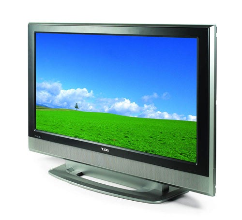 Acer AT3720 37-inch LCD television with a widescreen display, showing a vibrant image of a grassy field and blue sky, with a silver frame and matching stand.