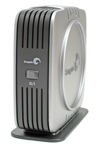 Seagate 500GB eSATA external hard disk standing upright on a black stand, with a black and silver case design, featuring a power button and Seagate logo on the front.