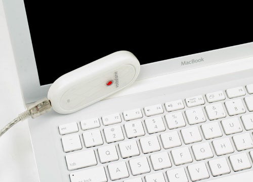Vodafone USB Mobile Connect Modem connected to a MacBook.
