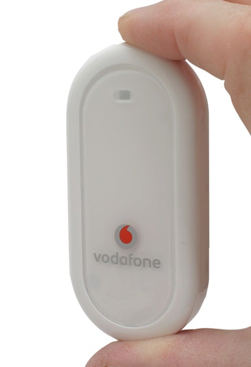 Hand holding a Vodafone USB Mobile Connect Modem.