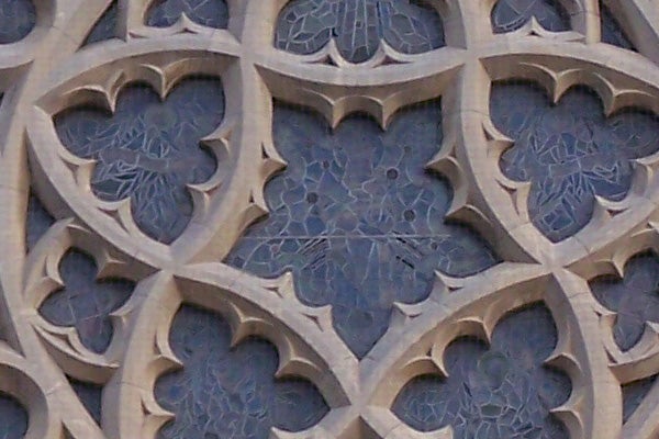 Close-up of the intricate details of a Gothic-style stone tracery wall showing the capabilities of Kodak EasyShare Z710 camera's zoom function.