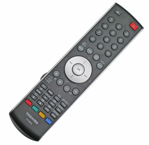 A Toshiba Regza television remote control with an array of black and gray buttons, including a red power button at the top, navigation controls in the center, and colored buttons at the bottom.