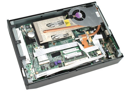 Shuttle XPC X100 small form factor computer open case showing internal components such as motherboard, RAM, cooling system, and expansion slots.