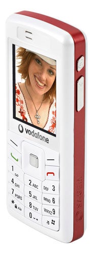 Sagem My600v mobile phone with Vodafone branding, featuring a color screen displaying a photo of a smiling woman, traditional keypad, and red and white casing.
