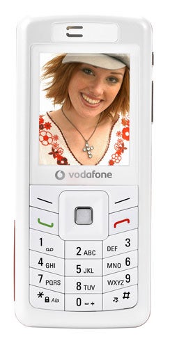 White Sagem My600v mobile phone with Vodafone branding, featuring a color screen displaying a smiling woman's photo, a numerical keypad, and call buttons.