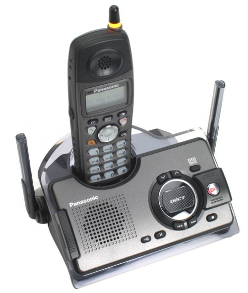 Panasonic KX-TCD290 Rugged DECT Phone with handset placed in the charging cradle, featuring a prominent antenna, a speaker, a digital display, and buttons on the handset, with base station having additional buttons, a speaker, and dual antennas.