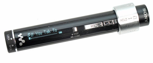 Sony Network Walkman NW-S203F digital music player with display screen on, control buttons visible, and lock switch engaged.