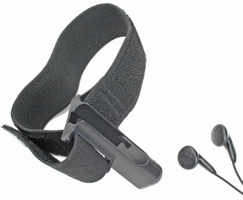 Sony Network Walkman NW-S203F with its distinctive round shape attached to a black fabric armband and accompanied by black earbud headphones on a white background.