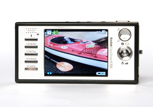 Kodak EasyShare V705 Dual Lens digital camera displayed with an image of a red boat on its LCD screen.