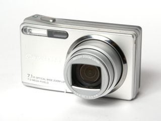 Ricoh Caplio R5 digital camera with extended zoom lens on a white background.