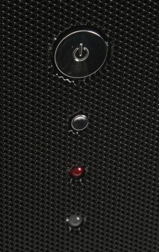 Close-up view of the power button on a Thermaltake Mozart TX computer case with surrounding LED indicators.