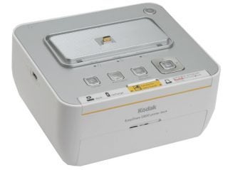 Kodak EasyShare G600 Printer Dock on a white background, showing the top control panel with buttons and the photo paper tray.