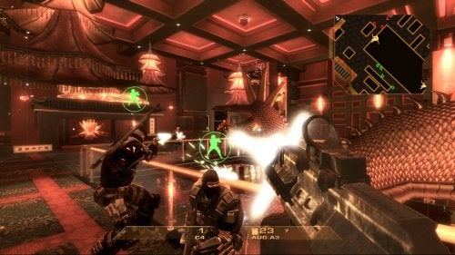 In-game screenshot from Tom Clancy's Rainbow Six: Vegas for Xbox 360 showing a first-person perspective with a player's character holding a gun, teammates highlighted with green circles, and a tactical map in the upper right corner.