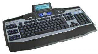 Logitech G15 Gaming Keyboard with blue backlit keys and programmable G-keys, featuring an integrated LCD display panel.