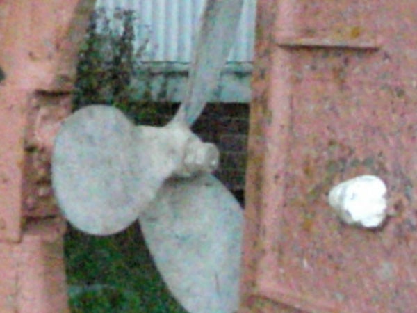 A low-resolution image showing the blurry detail of a ship propeller, indicating poor image quality likely related to a camera's performance.