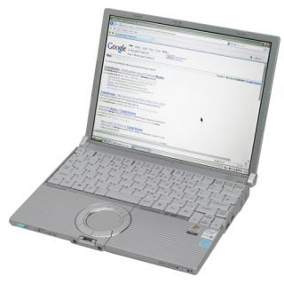 Panasonic ToughBook CF-W5 laptop open on a table displaying a Google search results page on its screen.
