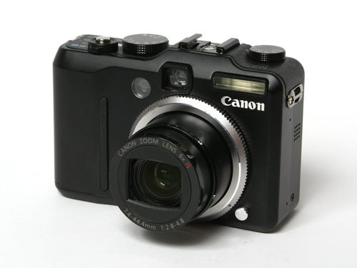 Canon PowerShot G7 camera displayed against a white background, showcasing its lens and front controls.