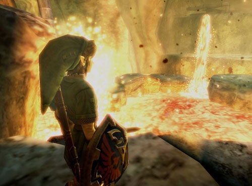 Link character from The Legend of Zelda: Twilight Princess standing in a cavern with lava and glowing particles.