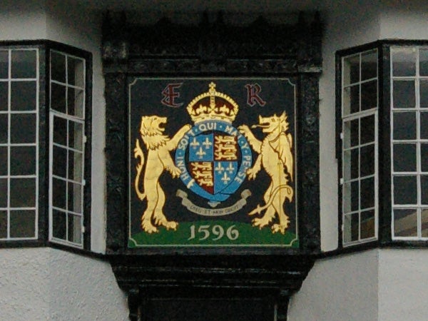 Coat of arms on building captured with Pentax K100D camera.