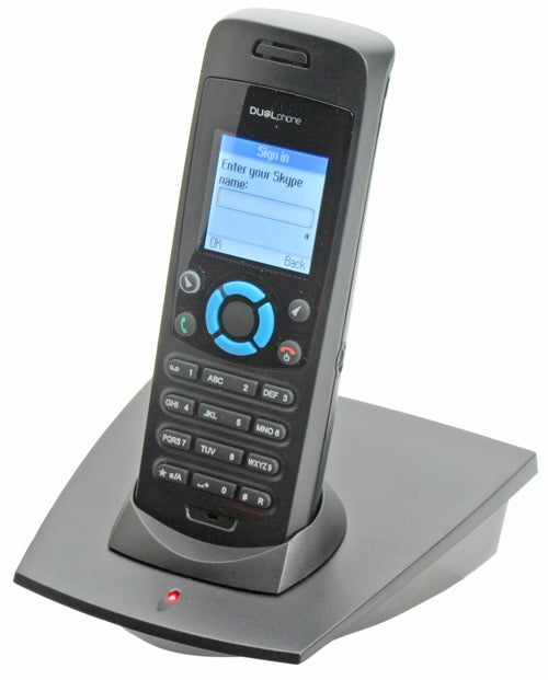 Dualphone RTX 3088 cordless phone docked in its charging station displaying the Skype sign-in screen.
