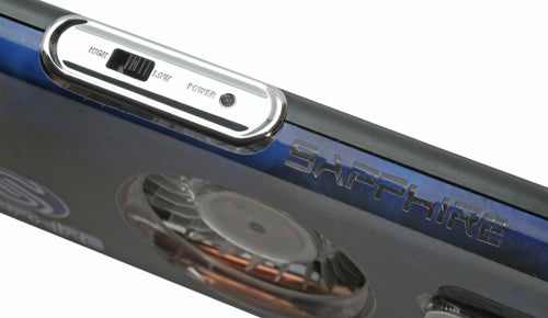 Close-up view of the Sapphire TOXIC X1950 XT-X graphics card showing the brand name embossed on the side, with a focus on the power connector and voltage control switch.
