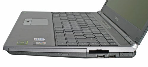 Sony Vaio VGN-SZ3XP laptop open at a side angle showing the keyboard and screen, with a focus on the distinctive Vaio logo.