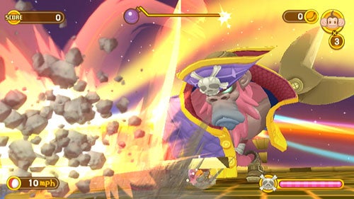 Screenshot from the video game Super Monkey Ball: Banana Blitz showing a character in a ball navigating through a level with a rock explosion obstacle and score indicators visible on the screen.
