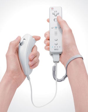 Two hands holding a Nintendo Wii remote and Nunchuk controller against a white background.