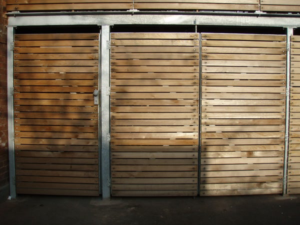Wooden slatted garage doors in a well-lit setting, likely demonstrating the image quality of the Olympus mju 725 SW camera.