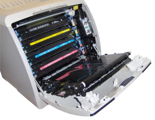 Canon LaserShot LBP-5000 color laser printer with open front cover revealing toner cartridges and internal components.