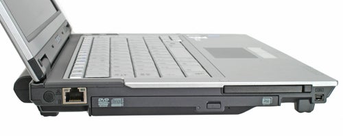 Side view of a Samsung Q35 Red Core 2 Duo laptop showcasing its ports and DVD drive, with part of the screen visible.